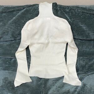 Women’s Cream Turtleneck Knit Top with Flared Cuffs